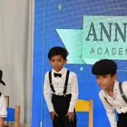 Students perform in front of the Annual Function stage backdrop