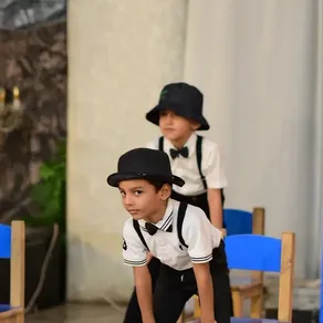 Students perform on stage at the Spring Buds Annual Function