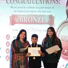 A Spring Buds student receives a Bronze award in the Creative Writing category at Create for Peace 2026