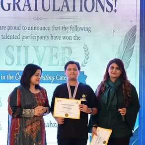 A Spring Buds student receives a Silver award in the Creative Writing category at Create for Peace 2026
