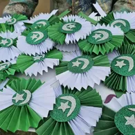 Handmade crescent-and-star rosettes crafted by Montessori children